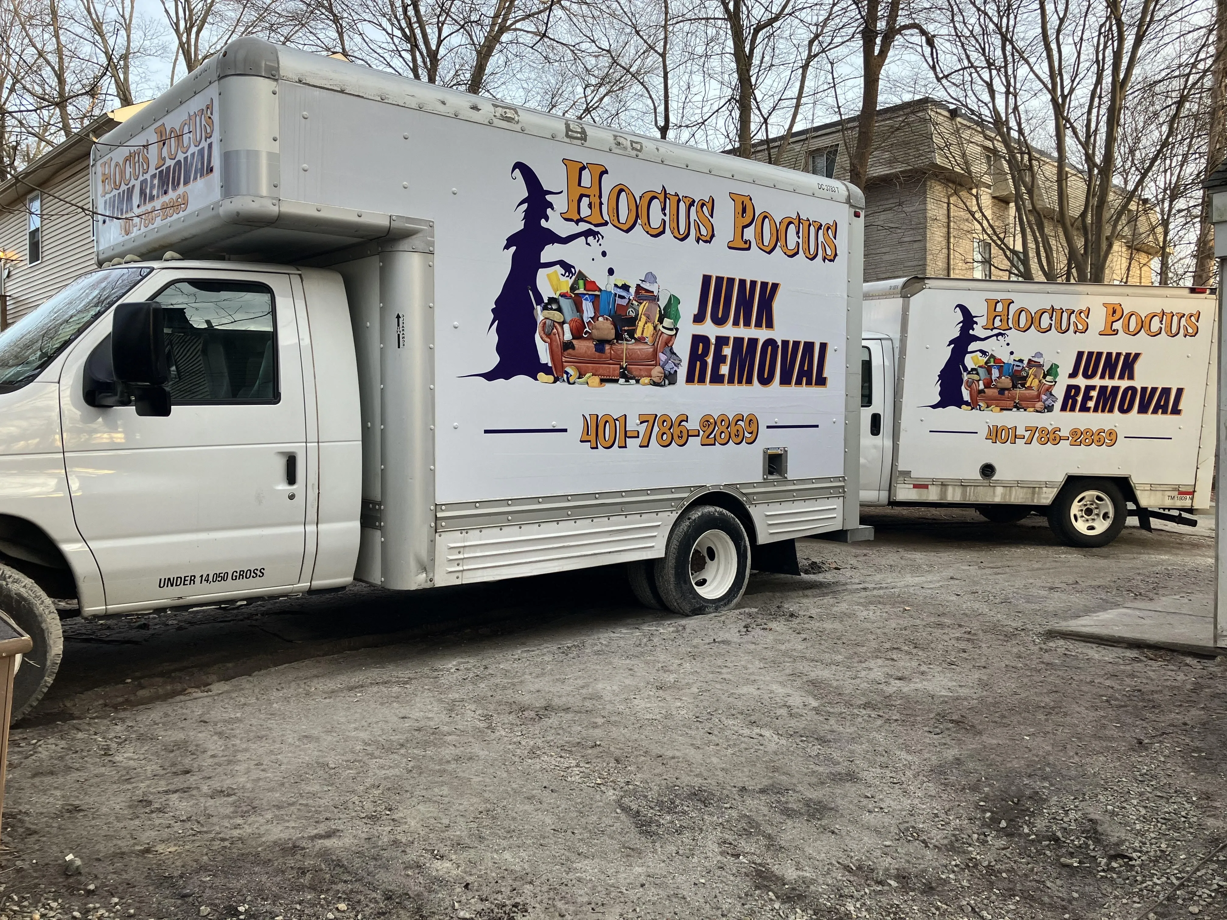 Two Hocus Pocus Junk Removal trucks