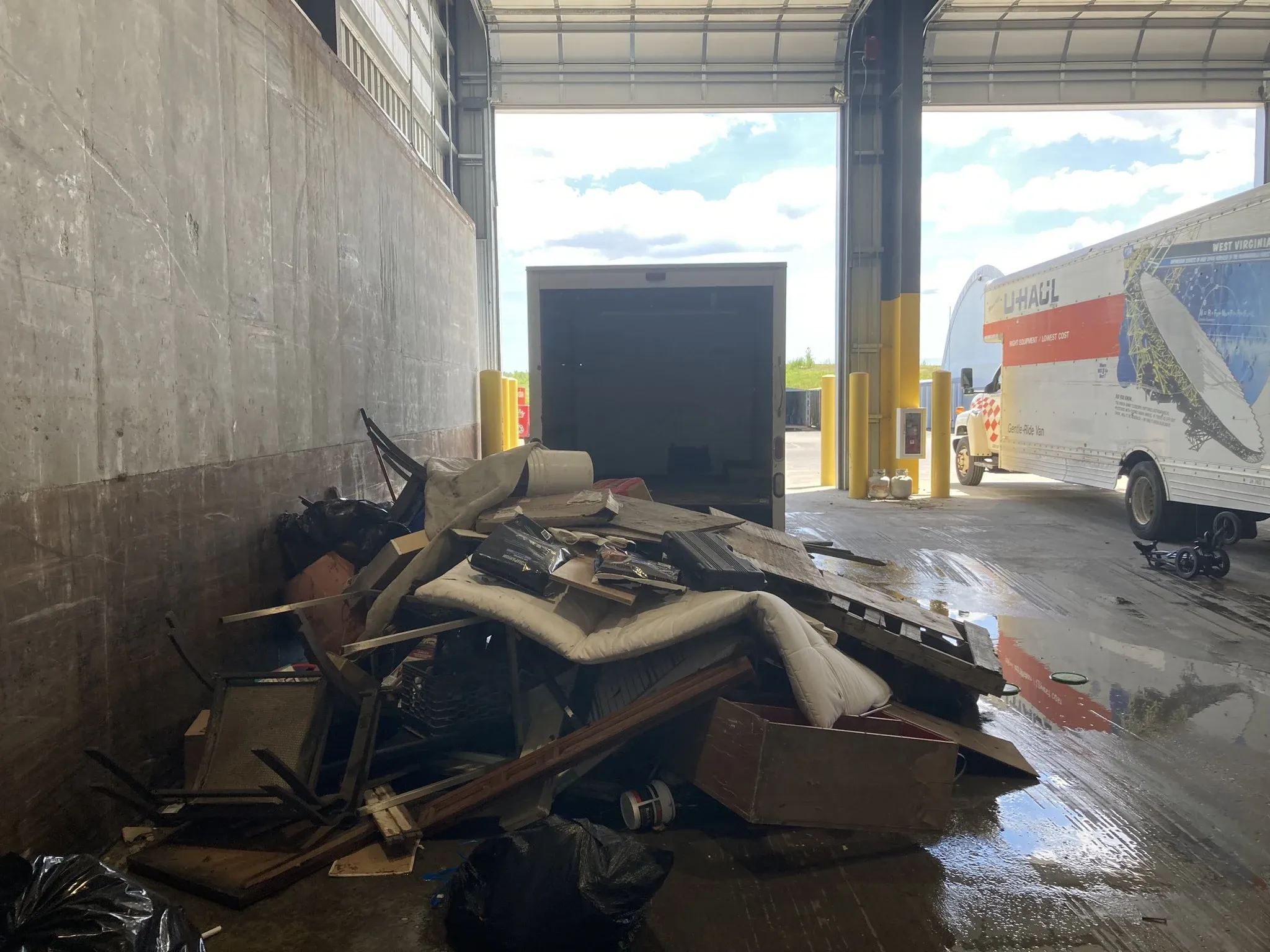 Hocus Pocus Junk Removal unloading a truck at the landfill